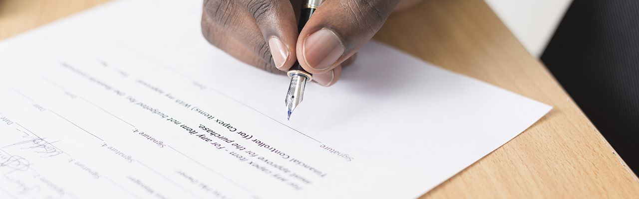 hand signing legal document