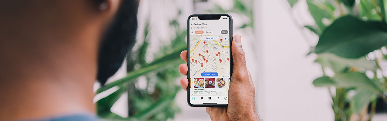  someone-viewing-their-phone-on-a-map-application