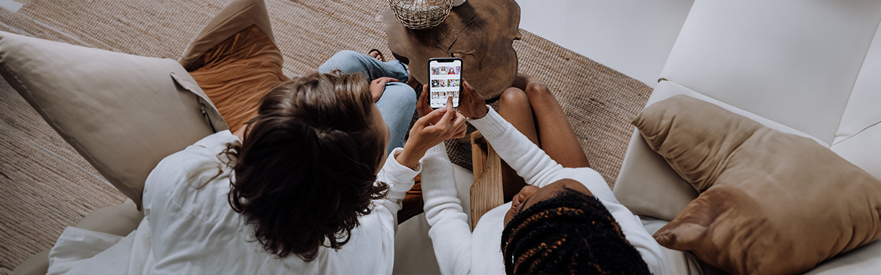 women-holding-phone-mobile-advertisement