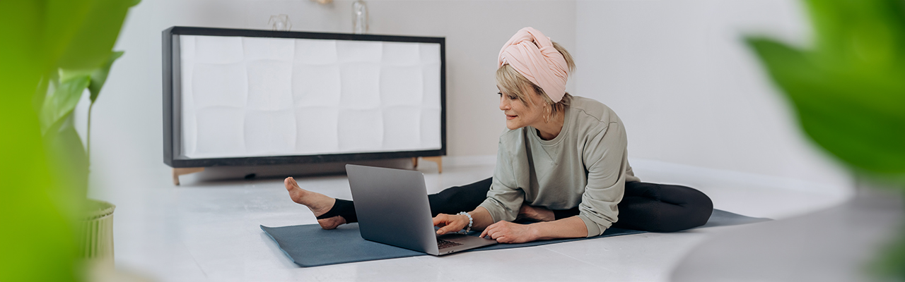 woman-doing-yoga-through-her-laptop