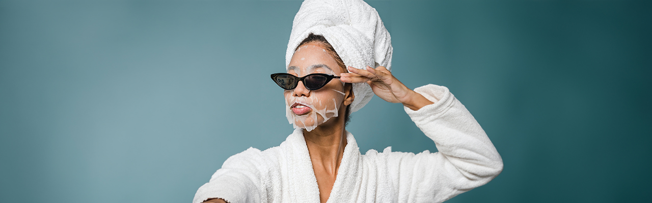 woman-with-facial-mask-beauty-wellness